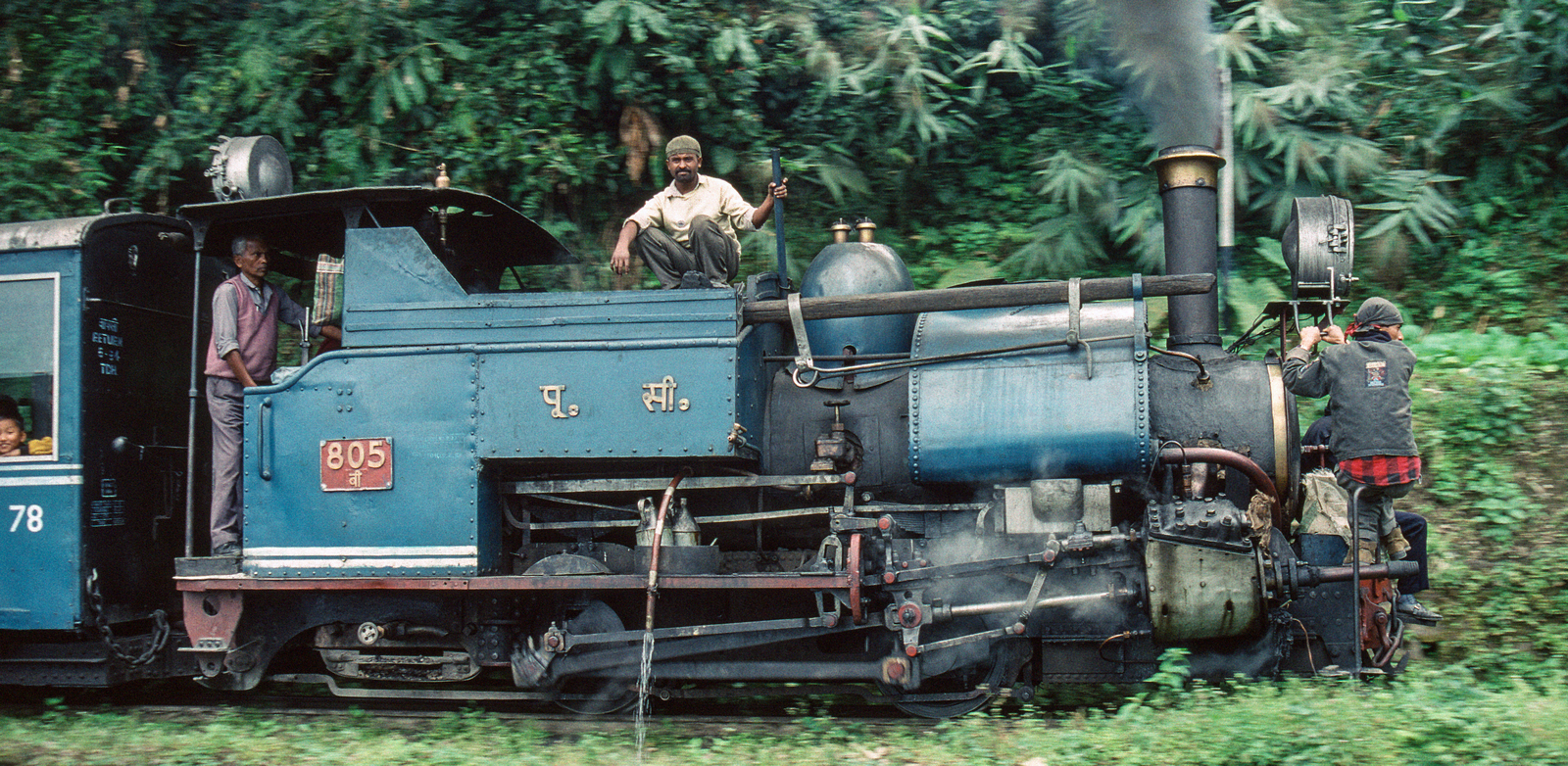 Built in 1925, No. 805 in December 1995 with human sanders at the front and another employee breaking the lumps of coal into manageable pieces as the journey progressed