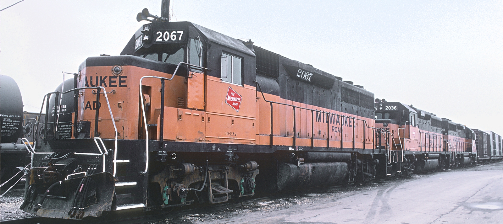 Three Milwaukee Road GP40s in 1985 in Bensenville, Illinois