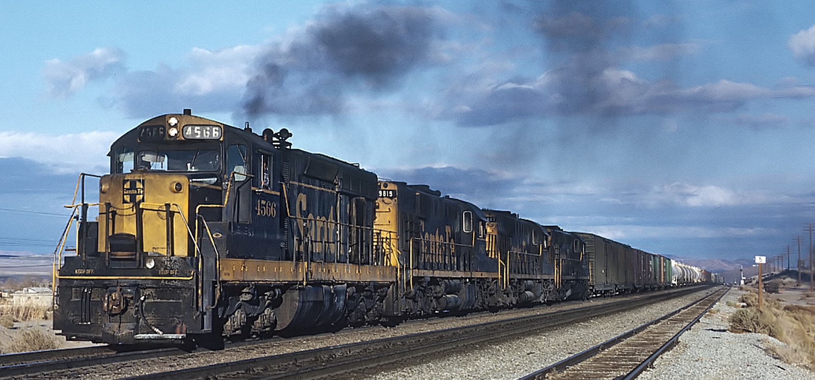 Four Santa Fe SD18s in 1971 with a freight train