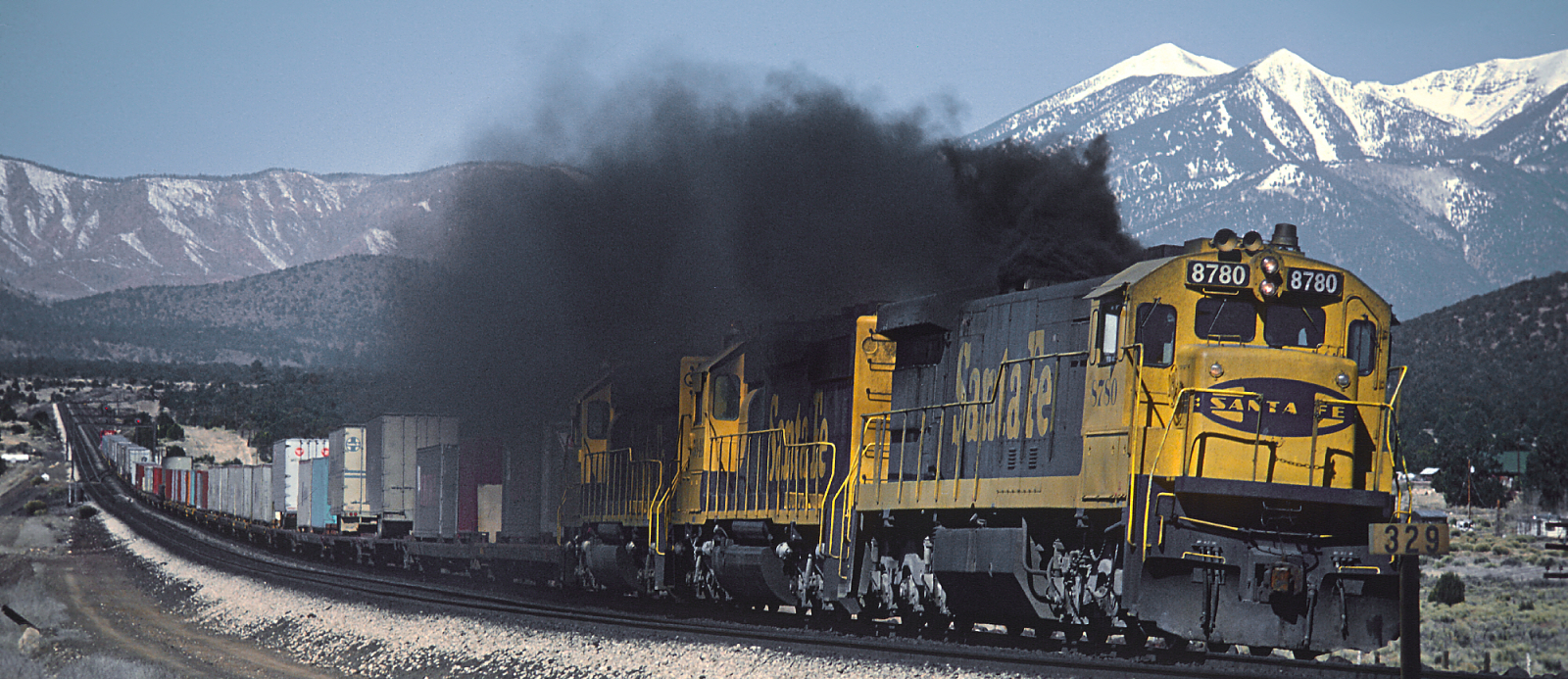 A freight train in Darling, Arizona is led by a heavily sooting U36C