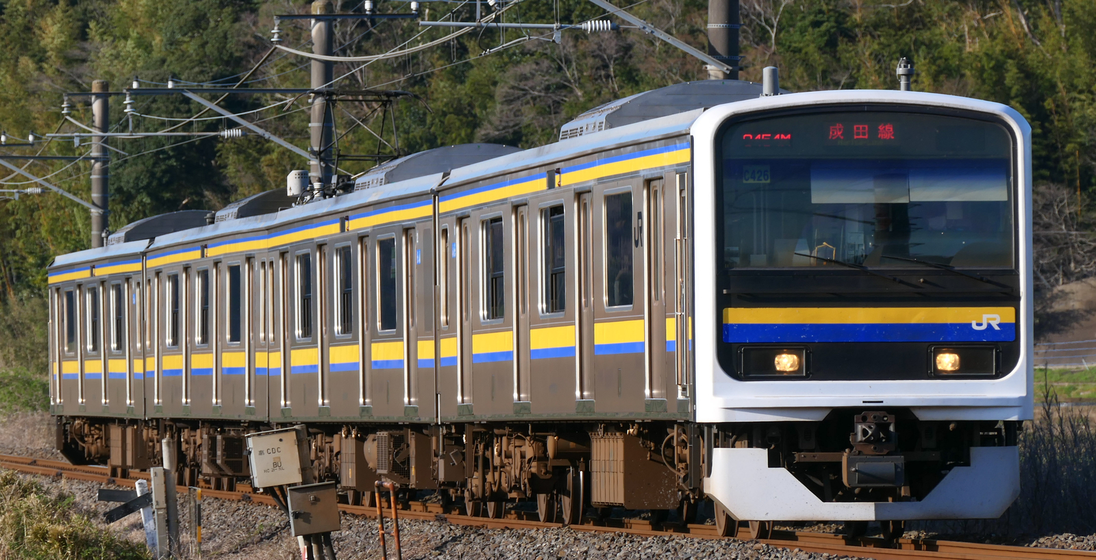 Class 209-2100 four-car train in March 2021 at Kuzumi, Narita