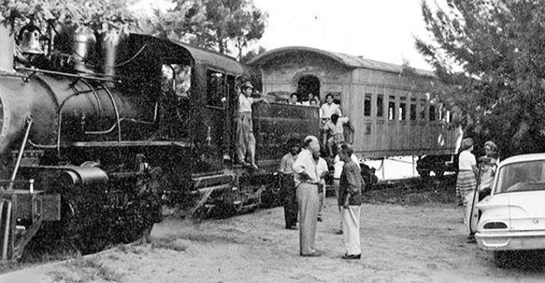 The presence of the 1960 Ford Ranch Wagon in the photo shows the long service life of the locomotive