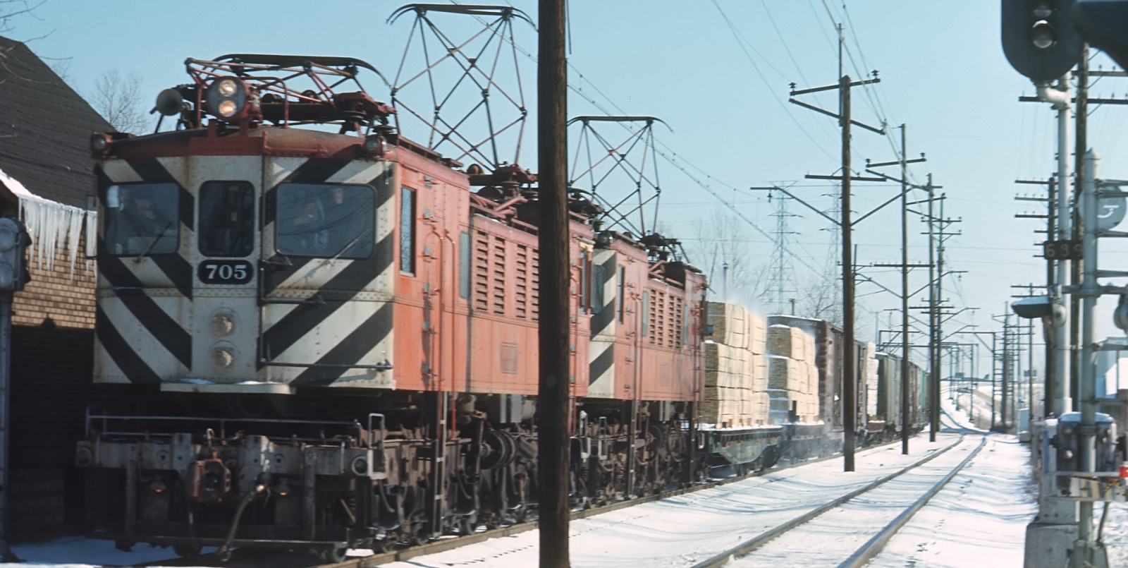Two six-axle Chicago South Shore & South Bend R-2s in front of a freight train in February 1972